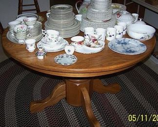 Oak pedestal table w / two leaves (no chairs), china including Haviland, Mikasa, Royal Albert, etc...