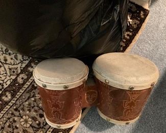 Tiki bongo drums.  One head is torn. 