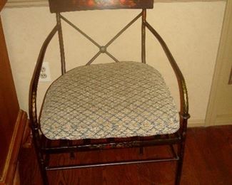 Vintage metal stenciled arm chair.