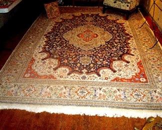 137 in. by 97 in. Kirman hand knotted wool oriental rug in excellent condition.