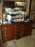 Wonderful antique Duncan Phyfe style 8 drawer dresser and mirror. The wood looks to be walnut, very beautiful grain. Nice pulls. Clean.