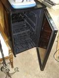 Wine bottle fridge, clean and works fine.
