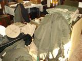 Lots of WWII military issued clothing and many footlockers.