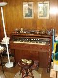 Ann Arbor pump organ; works fine. Old claw-feet stool.