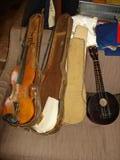 Stradivarius copy (needs restringing) w/case. Ukele or mandolin, not sure.