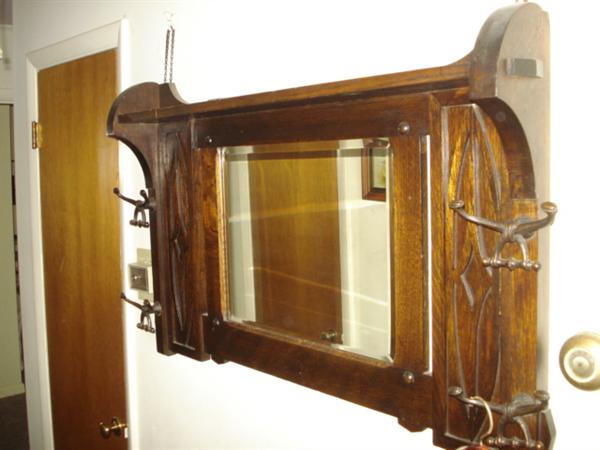 early 1930s oak wall-mount mirrored coat rack; very nice condition; heavy - weighs aprox 50 pounds