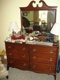 triple dresser with mirror, mahoganey. other pictures feature a matching pair of twin beds, & night stand