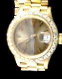 Ladies 18K Rolex, diamond bezel