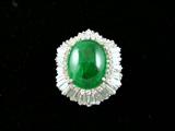 14K white gold pendant with 60 bagets surrounding a huge 20 Carat emerald