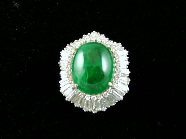 14K white gold pendant with 60 bagets surrounding a huge 20 Carat emerald