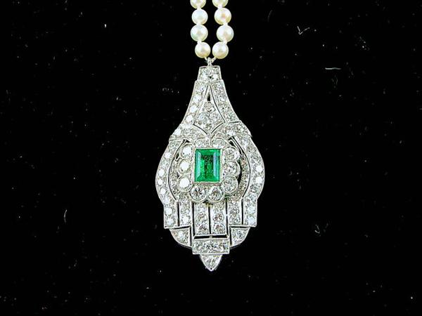 antique platinum art deco pendant with 70 diamond stones centered with a 1.5 carat x-fine emerald; total weight 5.3 carats; attached to 3.5 mm, 28" long pearl necklace! wow!