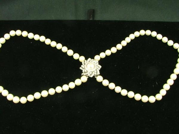 double pearl choker of 8.5mm pearls, 14" in length each, with a 1.0 carat diamond attached
