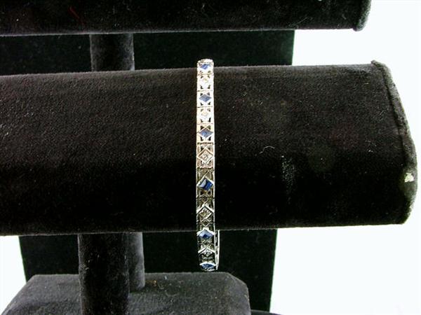 14k white gold bracelet laced with 3.5 carots of diamonds and 2 carots of sapphires.