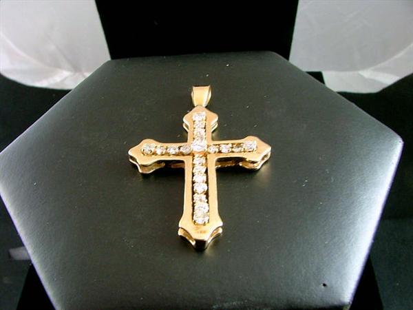14K gold cross pendant with 2 carots of diamonds laced within