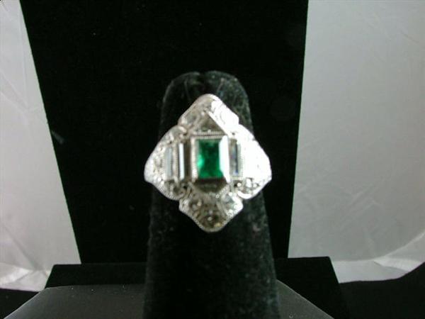 Eduardian platinum 2.0 carat euro-cut emerald with 1.1 carats of diamonds