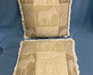 Two nice beige throw pillows with zebra motif