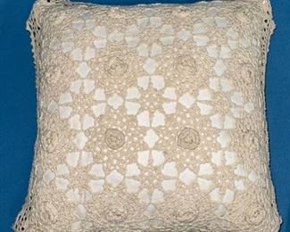 Throw pillow with knitted cover