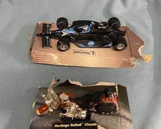 Two model vehicles (car has repaired front spoiler)
