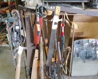 Tools all displayed on an old iron rolling rack