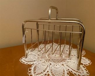 Gold tone MCM magazine rack or a 21st century bath towel holder