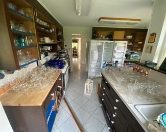 Hundreds of glasses, mugs, plates, dishes, silverware, and knifes!