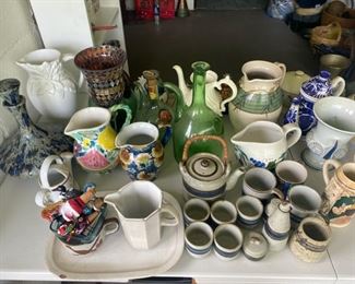 Lots of old teacups, pitchers, and unique glass pieces for sale!