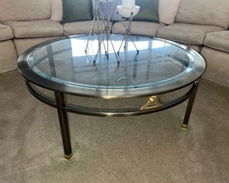 Round brass coffee table with glass top $325