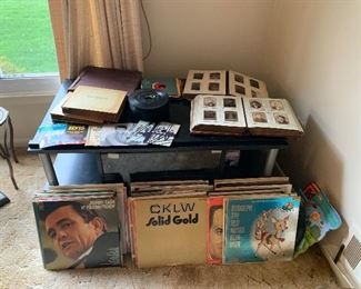 Albums, 45’s & 78’s. Lots of country music. 

Antique photographers photo albums.  
