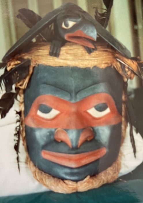 Original Duane Pasco “ Human to Raven” Nax Nok mask Simshian style. Carved red cedar,  red cedar bark, painted with iron oxide pigment graphite, adorned with crow feathers. Field Museum Of Natural History Certification. 1982 