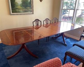 Banquet sized antique table (shown with 2 extensions in) and 6 chairs.  Blue rug also available.