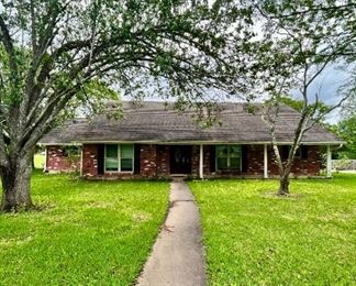 Lovely Home located in Friendswood Texas in an established neighborhood on a corner lot.  A story and half with detached garage 
