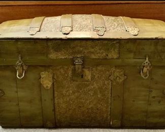 Antique Dome Trunk with Embossed Tin and Wood Slats, Painted with original Leather Strap Handles.  Trunk has been painted with 1970’s Avocado Green Antique Paint Fad.  (28”W x 16”D x 18”H)