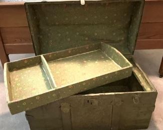Inside view: Antique Dome Trunk with Embossed Tin and Wood Slats, Painted with original Leather Strap Handles.  Trunk has been painted with 1970’s Avocado Green Antique Paint Fad.  (28”W x 16”D x 18”H) with Fabric Lining