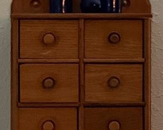 Antique Wooden 8-Drawer Spice Cabinet.  Also shown:  Vintage Cobalt Blue 6” Bud Vase, Vintage Threaded Top Bromo-Seltzer Bottle and an Antique Cobalt Blue Bottle with  Bromo-Seltzer Emerson Drug Co. Baltimore embossed on side. 