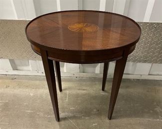 $350 - ﻿Marquetry Center Medallion Oval Occasion Tapered Leg Wood Table - KS83-7
LOCATION: Germantown, MD
WHY WE LIKE IT:  A lovely Federal Style mahogany side/end tables. This mahogany constructed table features an oval shape, decorated with a beautiful marquetry inlay medallion. Lovely grain pattern, delicate inlay around the aprons and stand upon four square-cut tapered legs. The diminutive size and graceful style of this table make it perfect as an accent piece in multiple room settings.
DIMENSIONS: 19.5" x 14.5" x 22"H
CONDITION: Please refer to photos for a more detailed look at condition.  We make every attempt to list and photograph any defects or signs of wear that are significant to this sale. 
LOCAL PICK UP.   BUYER IS RESPONSIBLE FOR ANY NECESSARY DISASSEMBLY AND ALL COSTS ASSOCIATED WITH SHIPPING OR PICK UP.  PLEASE CONTACT US FOR SHIPPING REFERRALS.
