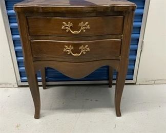 75 - ﻿Serpentine Two Drawer End / Side Table With Brass Hardware - KS83-11
LOCATION: Germantown, MD
DIMENSIONS: 24" x 14" x 25"
CONDITION: Please refer to photos for a more detailed look at condition.  We make every attempt to list and photograph any defects or signs of wear that are significant to this sale. 
LOCAL PICK UP.   BUYER IS RESPONSIBLE FOR ANY NECESSARY DISASSEMBLY AND ALL COSTS ASSOCIATED WITH SHIPPING OR PICK UP.  PLEASE CONTACT US FOR SHIPPING REFERRALS.