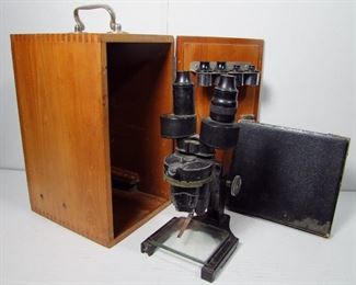 Lot 125   1940s Sargent Stereo Microscope with Case. Includes Case of prepared slides plus orig. dovetailed wooden case with key. 8” X 9 ½” X 14 ½”h. Cond: Moderate wear to the Microscope from use (tagged: US Dept. Agriculture).   $125 - $175