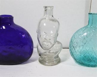 Lot 160   3 Pc. Bottle Collectors Lot. Includes C/1890 Clear crying baby form bottle for infant medications, Cobalt Flask with rough Pontil & some quilting patterns inside, Aqua Flask with star & cross hatch pattern with rough Pontil. Tallest 6”h. Cond: Chip on the baby bottle lip, Tiny chip on the cobalt bottle lip.   $100 - $150   Note: The 2 Historic Flasks were made around 1960 at the Greenfield Village Glass Works