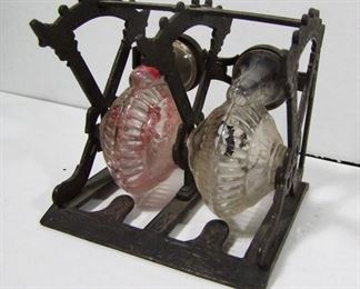 Lot 164   Patented Jan. 14, 1879 Cast Iron & pressed glass double Inkwell. The Iron pieces have overall Victorian decorations. 4 ½” X 4 ¼” X 4 ½” Cond: Ink remnants still in glass reservoirs, No other damage.    $100 - $150 