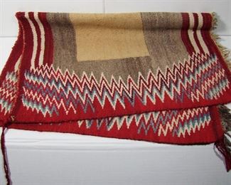 Lot 216   C/1930s Wool Navaho Indian Saddle Blanket. 5 Colors, Zig-Zag Borders on 2 sides, 25”X36”. Cond: Some small light stains and minor wear from use.   $150 - $250