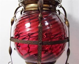 Lot 227   C/1880 Victorian Cranberry Glass Hanging Hall Lamp, All brass fixture, electrified, 9” dia. X 32”h.  Cond: Brass turned dark, oil burner replaced with electrical fixture (works).   $150 - $250