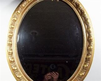 Lot 228   C/1900 French Louis 14th Oval beveled mirror, gilt floral and scroll decorations w/1” beveled plate mirror, 24” x 39” h.  Cond:  Some light wear to the gilt from cleaning. Small repair to top & bottom elements.   $250 - $350