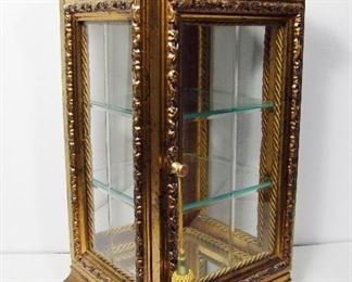 Lot 273   Mid 20th C.TableTop Display Case, French style, beveled glass panels on all 4 sides, gold leaf finish, Onyx marble inset top. 10” sq. X 19 ¼”h. Cond: Small corner chips on base trim. No other damage.   $100 - $175