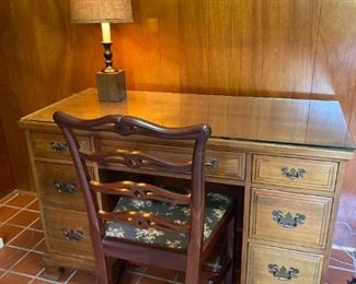 Davis Cabinet Company Walnut Desk With A Chair And A Lamp