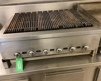 Commercial grade gas grill, unknown manufacturer, unknown working condition, front left leg is broken, H 13"x W 36"x D 27".