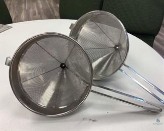 Two stainless steel 10" strainers, used condition.