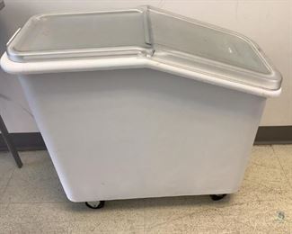 One Rubbermaid white plastic food storage bins on castor wheels, with lids, Model# 3600, H 28"x W 13.5"x D 31", used condition.