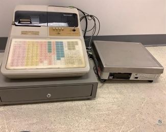 One Sharp cash register, Model# ER-A650, SN# 680009666, no key, H 13"x W 17.5"x D 19". Scale is hardwired to the register, Model# IS-400, SN# SRA7951840, H 5"x W 14"x D 12". All are used and unknown working condition.