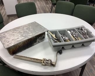 One commercial can opener size #1, stamped 1884, H18.5". One Vollrath stainless steel tray insert with lid, H6"x W 22"x D 13". Two plastic flatware trays with miscellaneous flatware pieces. All are used condition.