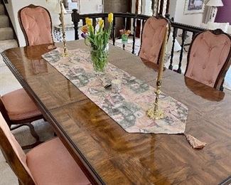 Wood dining room table with 8 chairs and two leaves, also includes table pads